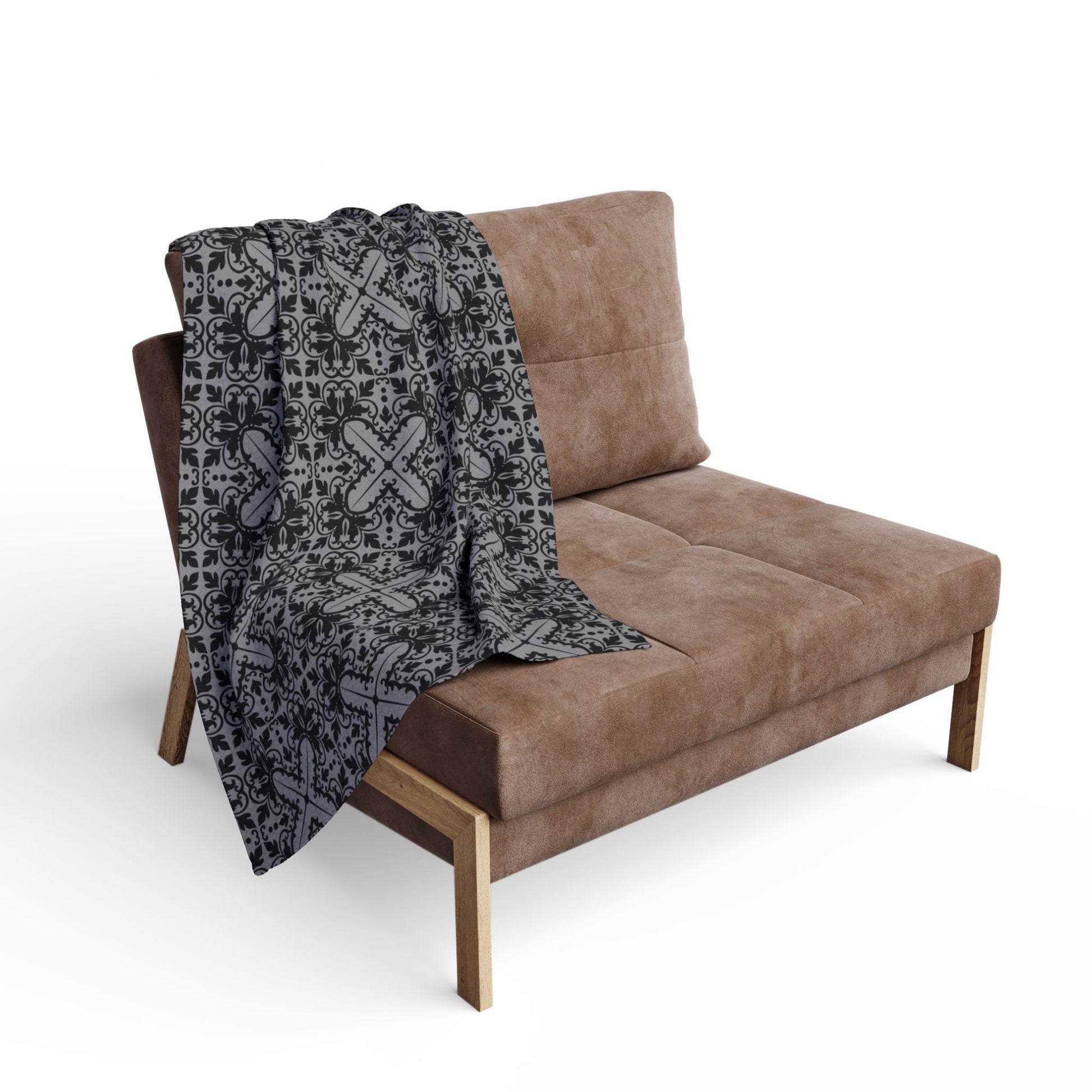 small grey blanket with a black damask gothic style pattern draped over a chair