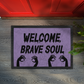 Welcome Brave Soul Horror Doormat with Zombie Hands – Grungy Light Purple Halloween Decor