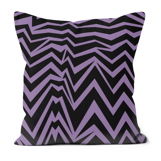 Bold black and purple zig zag pattern on a cushion.