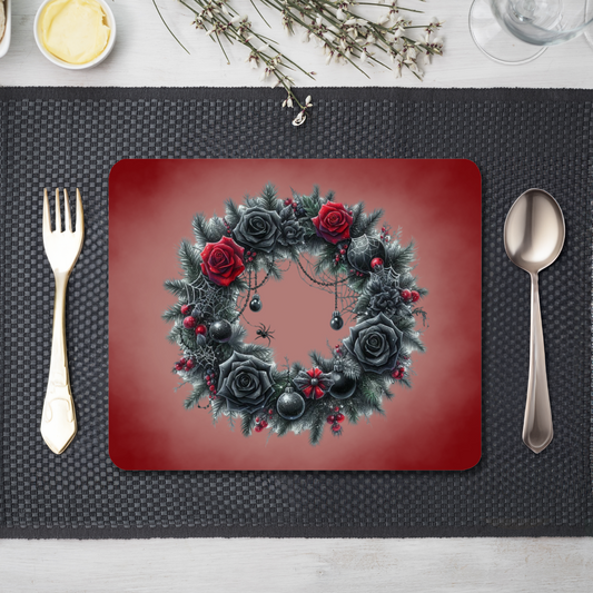 A table setting with cutlery and a red placemat with a smoky effect . A wreath with red and black roses, cobwebs and spiders is printed on the placemat 