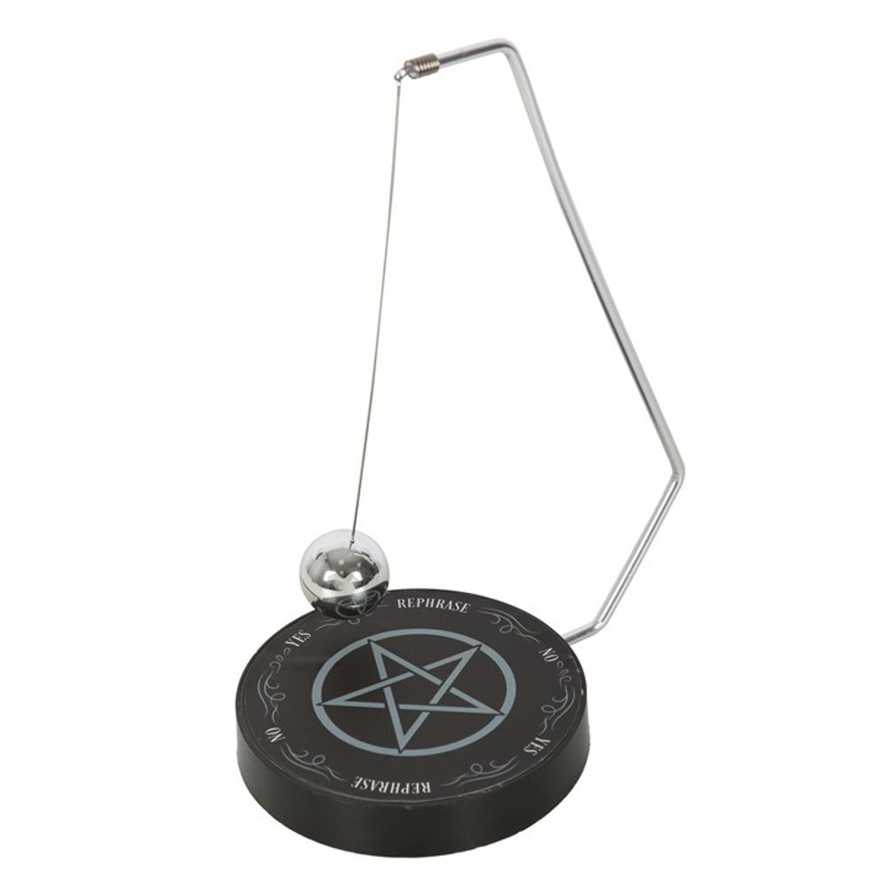 A pendulum decision maker hanging over a board with a pentagram and "yes" , "no", "maybe" and "rephrase" printed on it
