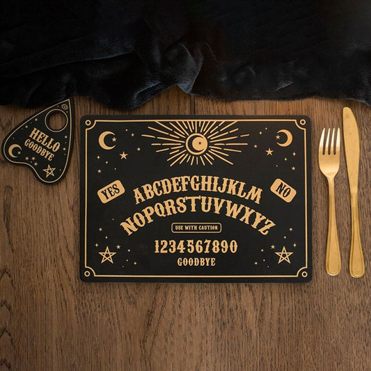 a wooden table top with a placemat and coaster set. They are printed with a talking board