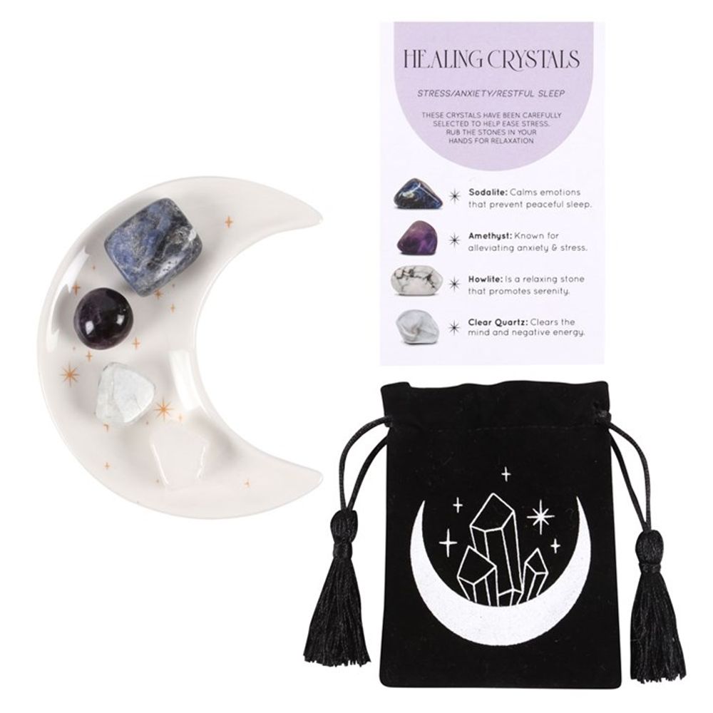 An image of a white half moon trinket dish with golden stars containing each of the 4 crystals available along with the small black velvet pouch with a moon and crystals on it