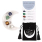 An image of a white half moon trinket dish with golden stars containing each of the 4 crystals available along with the small black velvet pouch with a moon and crystals on it