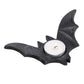 A tealight holder shaped like a bat containing a single tea light