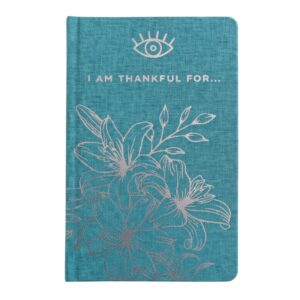 An aqua blue gratitude journal with silver flower lineart on the front