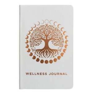 a white journal with a gold tree of life design
